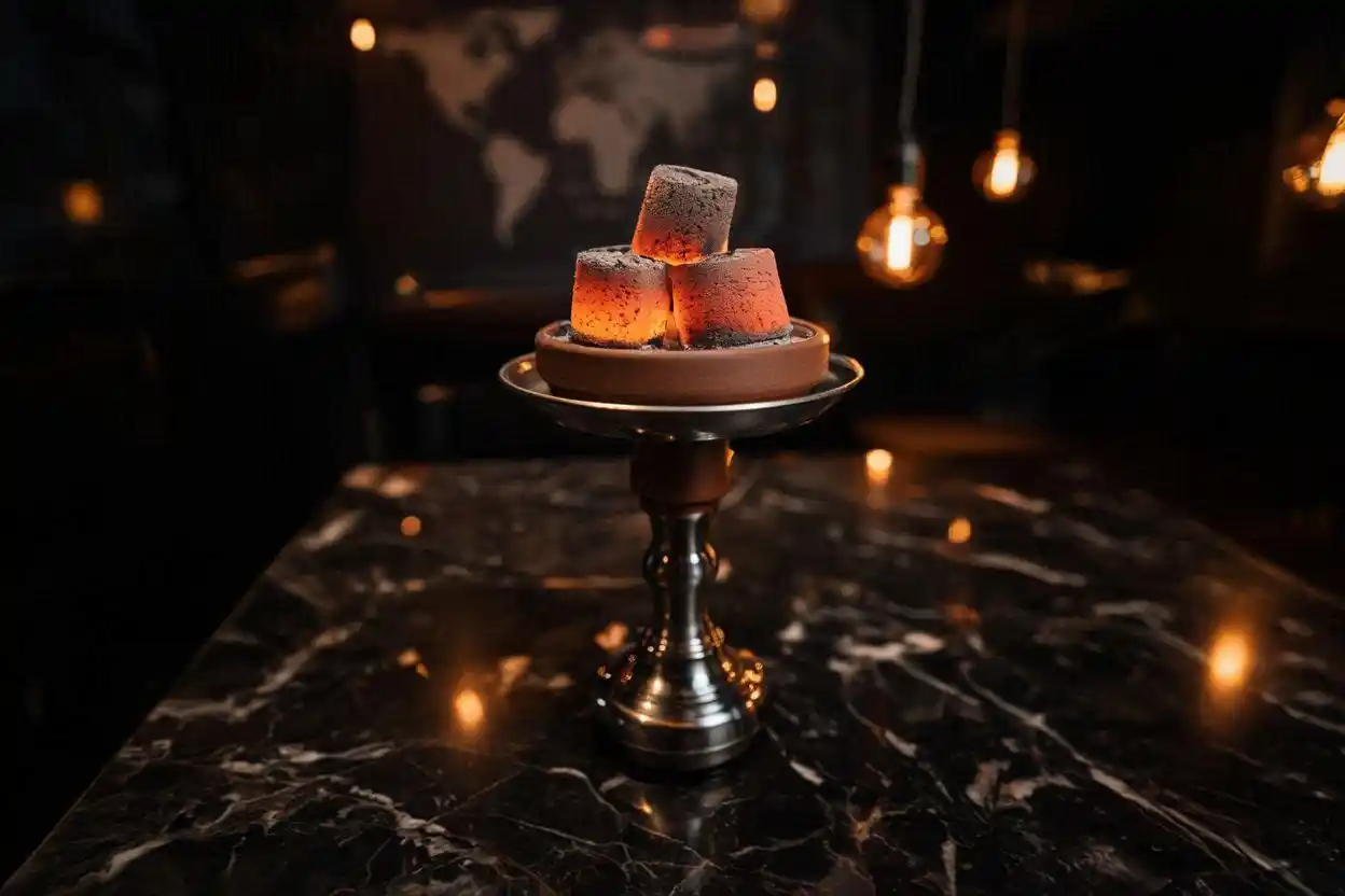 Glowing hookah charcoal briquettes on a shisha bowl representing worldwide demand growth